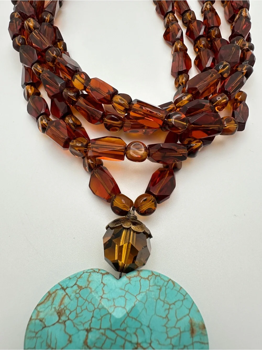 Multi-Strand Amber Glass Necklace with Turquoise Heart Pendant